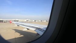 View over airplane wing during take off Stock Footage