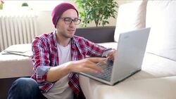 Young man concerned shopping online Stock Footage