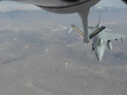 MS F-16 fighter jet approaching and refueling in mid-air, Colorado Rockies, Colorado, USA Stock Footage