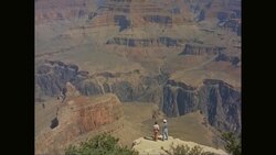 WS Men and women standing on cliff and looking at view of Grand Canyon / United States Stock Footage