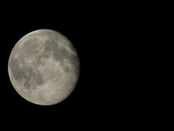 TIME LAPSE of EXTREMELY LARGE FULL SUPER MOON with clouds Stock Footage
