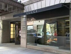 WS, Customer leaving Gucci store, Madison Avenue, New York City, New York, USA Stock Footage