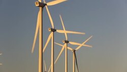 Part of the Tehachapi Pass wind farm, the first large scale wind farm area developed in the US, California, USA, at sunrise. Stock Footage