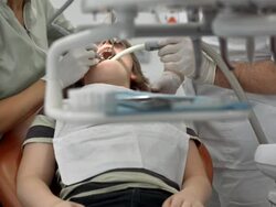 HD DOLLY: Dentist Drilling A Patient's Tooth Stock Footage