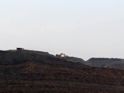 WS Diggers  excavating and  loading  trucks and general activity in opencast mine / Ffos-y-fran / Merthyr Tydfil, Glamorgan/Wales, United Kingdom Stock Footage