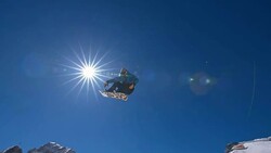 SLO MO Snowboarder jumping over kicker Stock Footage