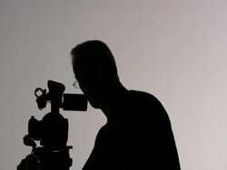 Videographer Cameraman Shooting, Turns Camera; Silhouette Stock Footage