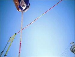 MS athlete Pole Vaulting, clears bar, low angle view, Australia Stock Footage