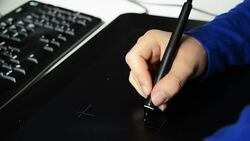 Designer Painting on Tablet with pen Stock Footage