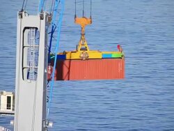 MS PAN Red container being moved by crane / Valparaiso, Valle Central, Chile Stock Footage