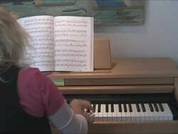 Woman learning to play the piano. With sound Stock Footage