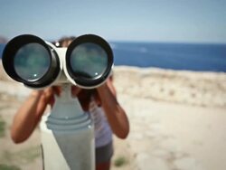 Woman using binoculars Stock Footage