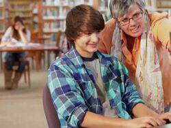 MS PAN Teacher helping two students in library / Santa Fe, New Mexico, United States Stock Footage