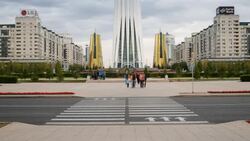 Central Asia, Kazakhstan, Astana, Bayterek Tower and the twin golden conical business centres - Time lapse Stock Footage
