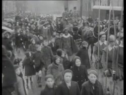 St. Nicholas arrives in Amsterdam by steamboat. He visits children whose fathers fight at the battlefront and gives them presents Stock Footage