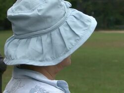Head shaking senior sitting in a park Stock Footage
