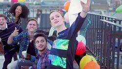 Confident young woman taking selfie with friends at urban rooftop party Stock Footage