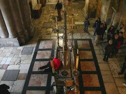 Jerusalem, Via Dolorosa (Jesus Way of Sorrows), 13th station of the Cross, the Stone of Anointing in the church of the Holy Sepulcher Stock Footage