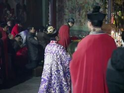 MS Taoist do religious rites with pilgrims to pray for good luck in grand hall of temple during Chinese Lunar New Year  AUDIO  / xi'an, shaanxi, china Stock Footage