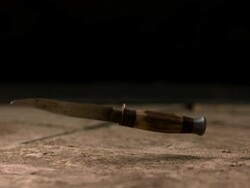 High speed Knife falling on pavement, low angle Stock Footage