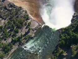 WS AERIAL View over Dramatic scenery of Yellowstone waterfall and tourist spot / Wyoming, United States Stock Footage
