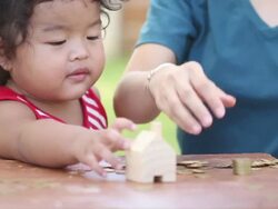 Cute boy with mother learn to count money Stock Footage