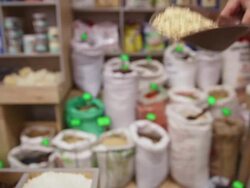 In the grocery. Taking barley flakes from sack Stock Footage