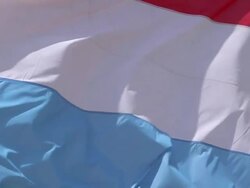 ECU SLO MO Shot of Grand Duchy of Luxembourg Flag Waving in the Wind / Caen, Normandy, France Stock Footage