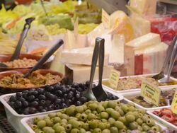 CU Shot of Pickled olives and cheese in delicatessen shop in Ambrogio market / Florence, Tuscany, Italy Stock Footage