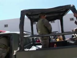 April 9 2009 MS ZI Mexican Soldiers boarding military truck and leaving, Juarez, Chihuahua, Mexico, AUDIO Stock Footage
