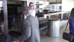 Armie Hammer & Elizabeth Chambers arriving at LAX Airport with their kid in Los Angeles Stock Footage