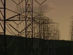 Long Shot pan,right , Power lines stretch from transmission towers. /  Stock Footage