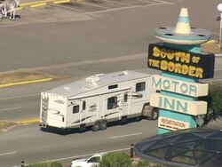 MS AERIAL TS Shot of car on South Of The Border amusement complex / South Carolina, United States Stock Footage