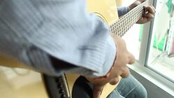 Playing acoustic guitar Stock Footage