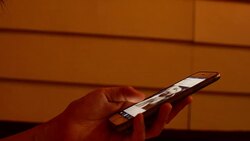 young woman using smart phone on the bed Stock Footage