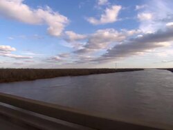 SIDE POV, Car crossing bridge over river, Shreveport, Louisiana, USA Stock Footage