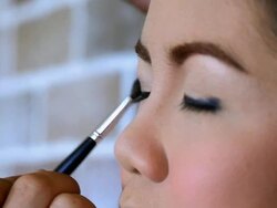 Makeup Artist Applying Make-up on Woman Eye Stock Footage
