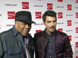 Joe Jonas & Quincy Jones at the Assouline and Memoire Set: Coca-Cola, Music & Sports launch event in Los Angeles, California on 12/05/13 Stock Footage