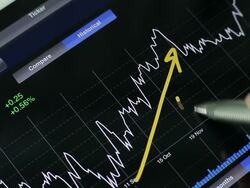 Businessman using Tablet analysis stock data. Stock Footage