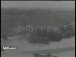 1944: BATTLE OF MOROTAI: VS U.S. Infantry Regiment soldiers in landing craft landing on Morotai Island, FLYING OVER amphibious assault on beach, soldiers landing &amp; wading through water. World War II, WWII, Pacific Front, Maluku Islands Instructional Video