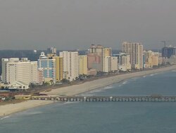 WS AERIAL View of myrtle beach and buildings with jetty / South Carolina, United States Stock Footage