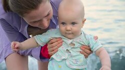 Mother with baby on the sea Stock Footage