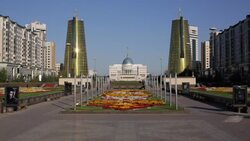 Central Asia, Kazakhstan, Astana, Presidential Palace and the twin golden conical business centres Stock Footage