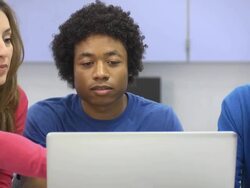 Instructor Assists Students with Laptop Computer Stock Footage