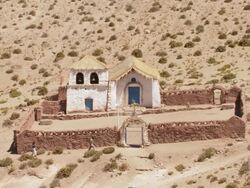 WS Shot of Country church at Machucca in high Andes and tourist looking at it / San Pedro de Atacama, Norte Grande, Chile Stock Footage