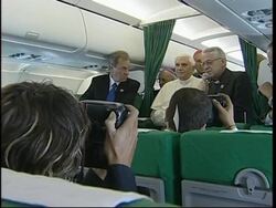 Pope Benedict talks to reporters on board plane travelling to Paris News Clip