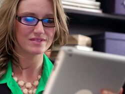 Woman in office looking at tablet Stock Footage