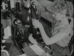 Women sew American flags in a factory. News Clip