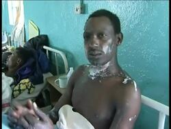 Rescuers combed a scorched forest for corpses Sunday and burn victims overwhelmed hospitals after an overturned gasoline tanker exploded as hundreds of people were trying to scoop up free fuel. News Clip