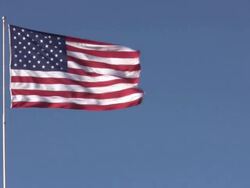 huge usa flag in strong wind Stock Footage